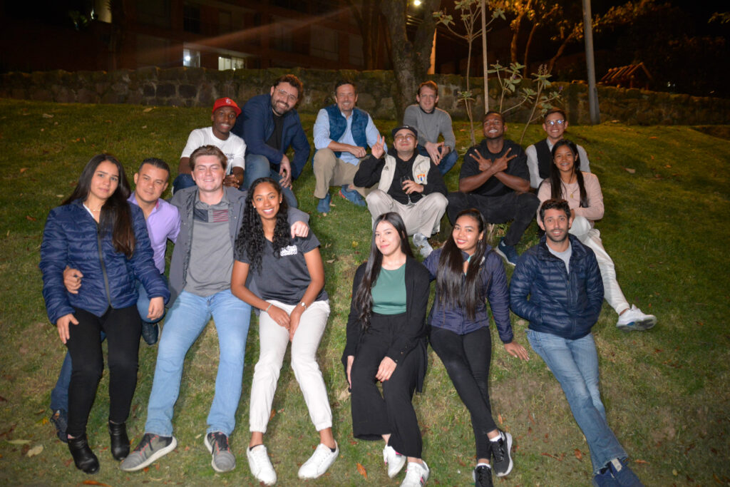 Group photo of volunteers and interns at night